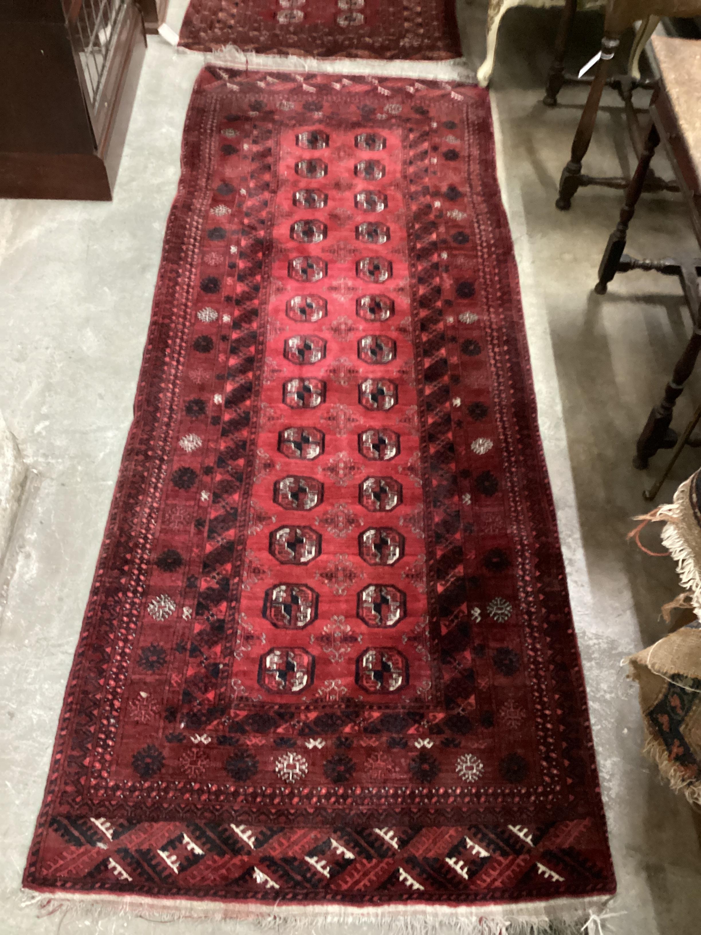 A Bokhara red ground runner, 266 x 100cm